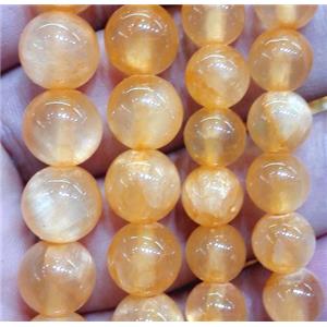 round jade beads, orange dye, approx 4mm dia