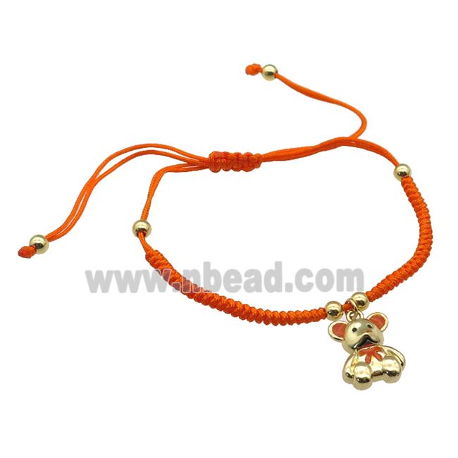 orange nylon bracelet with copper bear, adjustable