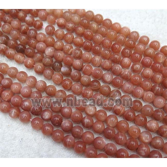 Sunstone beads, round, AAA-grade
