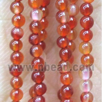 tiny red carnelian agate bead, round