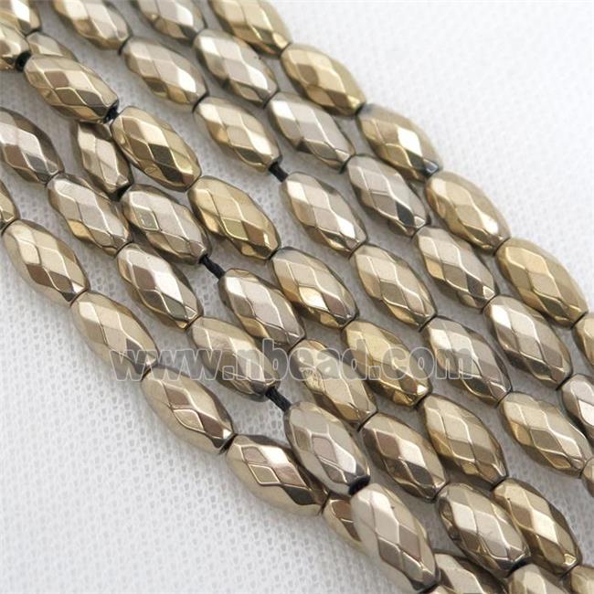 Hematite beads, faceted rice, pyrite color electroplated