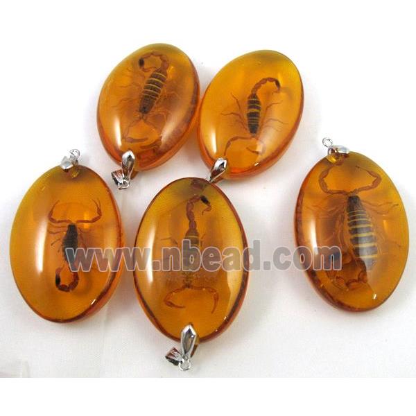 amber pendant, oval, golden
