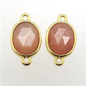 peach SunStone oval connector, approx 9-11mm