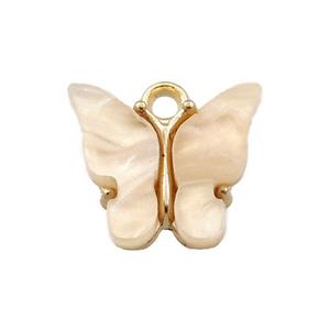 peach pearlized Glass butterfly pendant, gold plated, approx 13mm