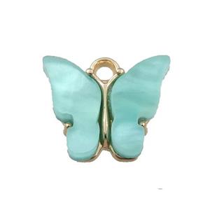 green pearlized Glass butterfly pendant, gold plated, approx 13mm