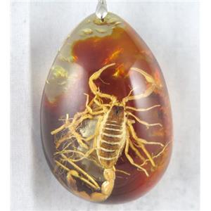 Amber teardrop pendant with scorpion, orange, NR, approx 40-60mm