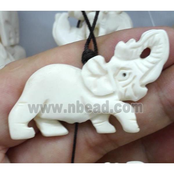 white antique cattle bone beads, elephant