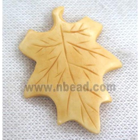 yellow cattle bone pendant, maple leaf