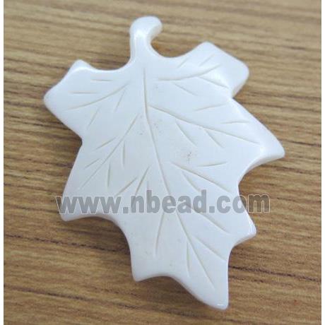 white cattle bone pendant, maple leaf