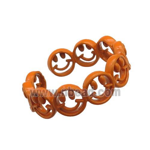 copper rings with orange lacquered