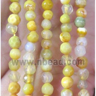 Tiny yellow agate bead, faceted round