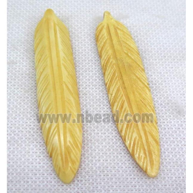 yellow bone feather pendant