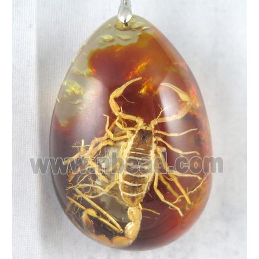 Amber teardrop pendant with scorpion, orange, NR