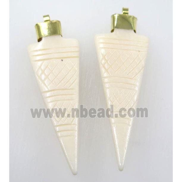 white cattle bone pendant, arrowhead