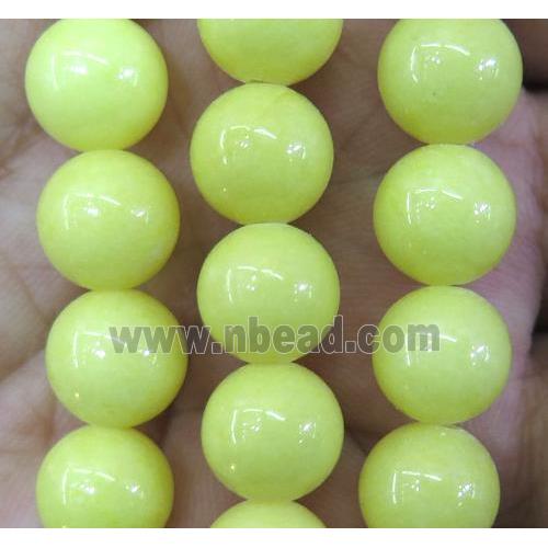 yellow jade bead, round, stabile